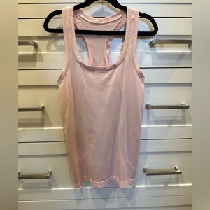 Lululemon size 2 light, light pink swiftly tech racerback tank.